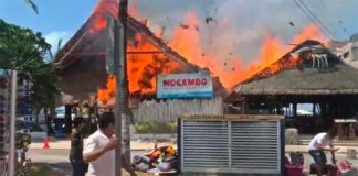 Mocambo restaurant and adjacent businesses burn during Monday's fire.