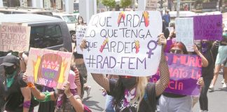 Women in Guadalajara protest the alleged murder of a migrant in Tulum.