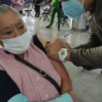 A senior citizen receives a Covid-19 vaccination in Mexico City.