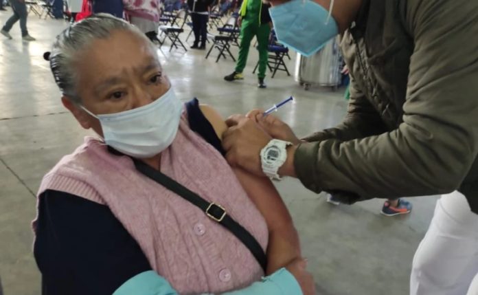 A senior citizen receives a Covid-19 vaccination in Mexico City.