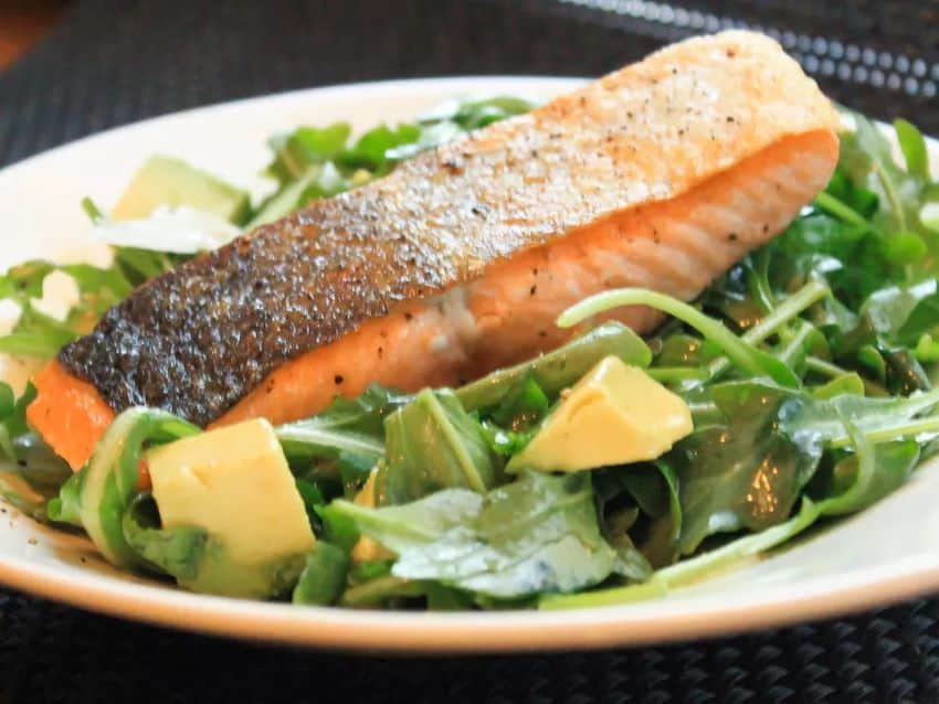 Pan roasted salmon with arugula and avocado