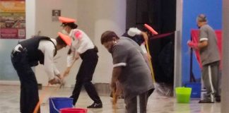 Mopping up wet floors at Benito Juárez International Airport.