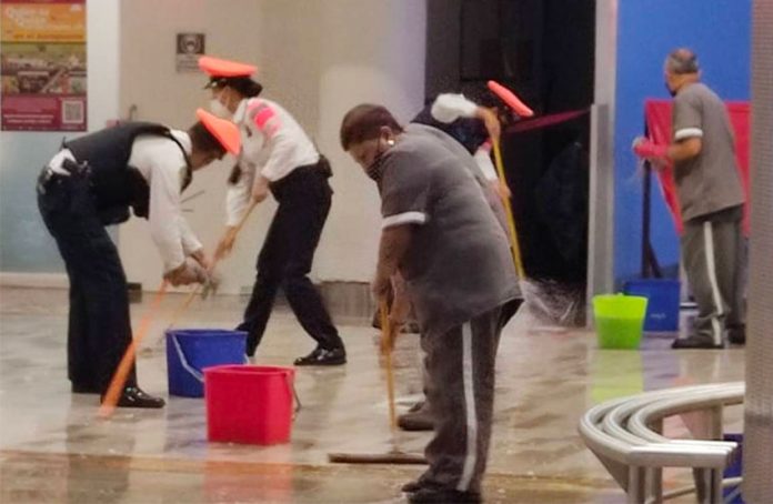 Mopping up wet floors at Benito Juárez International Airport.