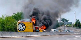 A truck burns on a highway in Michoacán Friday.
