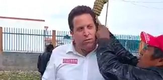 A noose is placed around the candidate's neck