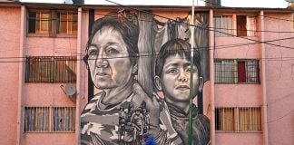 Paola Delfín's mural "Juntos" (Together), painted onto a building in the Paulino Navarro neighborhood of Mexico City.