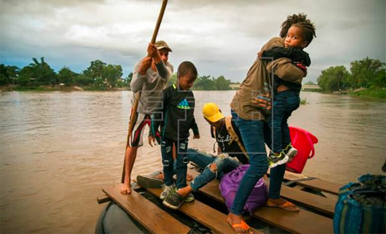 Migrants cross the Suchiate River into Mexico.