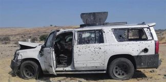 A bullet-riddled vehicle in Teocaltiche.