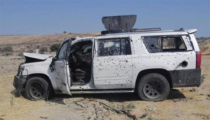 A bullet-riddled vehicle in Teocaltiche.
