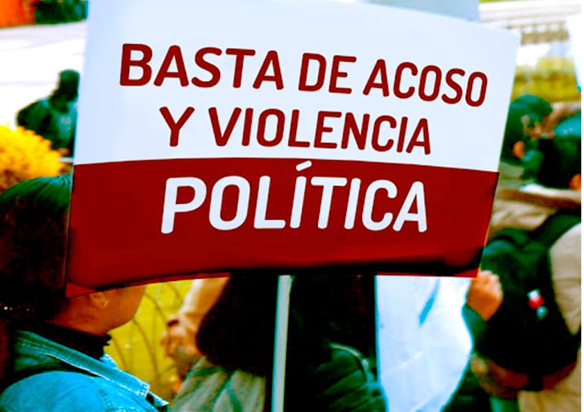 Woman holds sign calling for an end to assaults and political violence in Hidalgo.