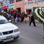 Funeral procession with taxi in Tenango del Valle, México state.