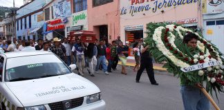 Funeral procession with taxi in Tenango del Valle, México state.