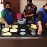 Woman make gorditas in Bernal's historic center.