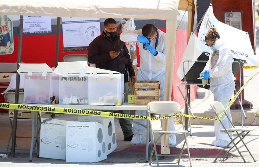 Forensic experts examine a polling station in Tijuana