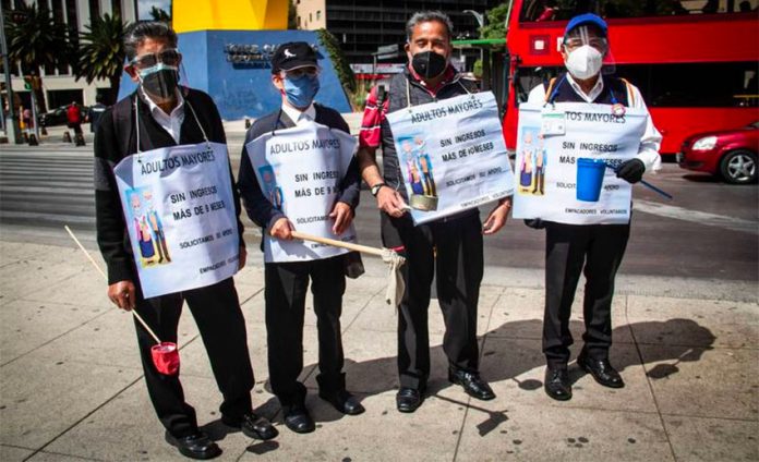 Seniors marched in protest against Walmart Wednesday in Mexico City.