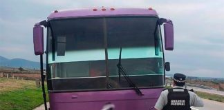 A National Guardsman in front of the stolen bus Monday in Tlaxcala.