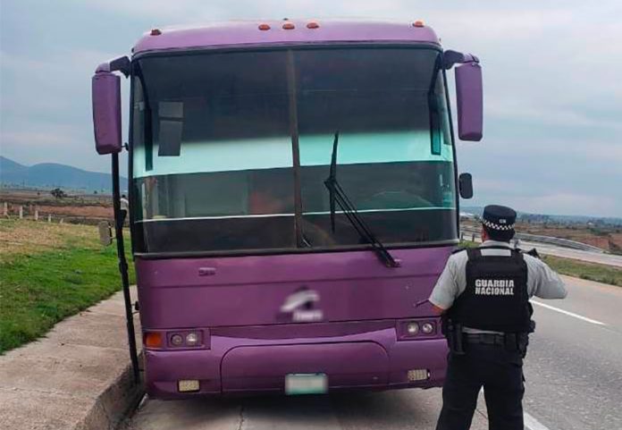 A National Guardsman in front of the stolen bus Monday in Tlaxcala.