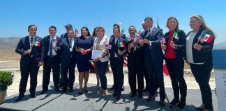 Mexican and US officials celebrating signing of agreement on Monday.