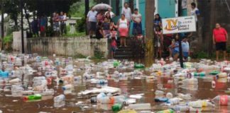 Garbage is swept away by floodwaters in Juchitán.