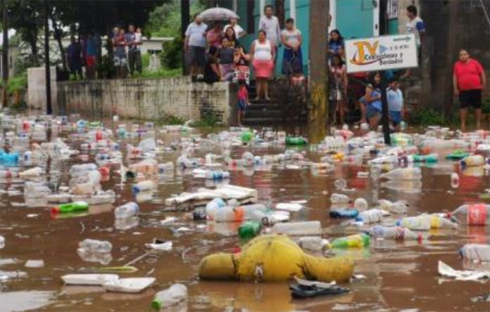 Garbage is swept away by floodwaters in Juchitán.