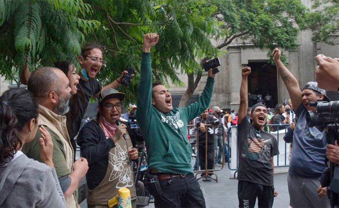 Supporters of legalization celebrate the court's ruling on Monday.