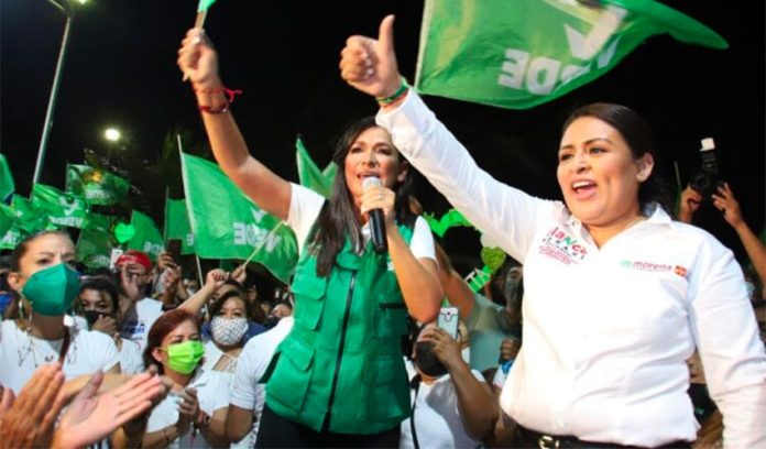 Merari, right, during her successful campaign for mayor after she took over for her late husband.
