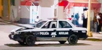 The patrol car in which the police were traveling when they struck a building.