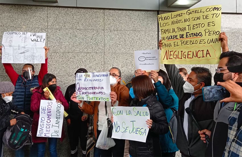 Parents protest cancer medications shortages at Mexico City airport Wednesday.