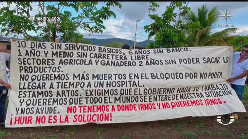 A banner in Aguililla lists the issues facing residents