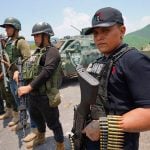 CJNG sicarios posed with their faces uncovered in a series of 2021 photos.