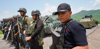 CJNG sicarios posed with their faces uncovered in a series of 2021 photos.