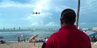 A drone flies over a beach in Mazatlán.