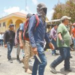 Members of El Machete self-defense group took control of the municipal government building mid-day on Monday.