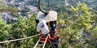 Rescue workers prepare to extract passengers from one of the Taxco cable cars.