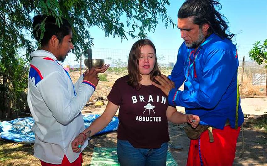 Shaman Octavio Rettig, right, and a candidate for treatment.