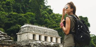 A visitor at a Mayan archaeological site.