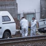 Forensic personnel recover two bodies Thursday in Zacatecas.