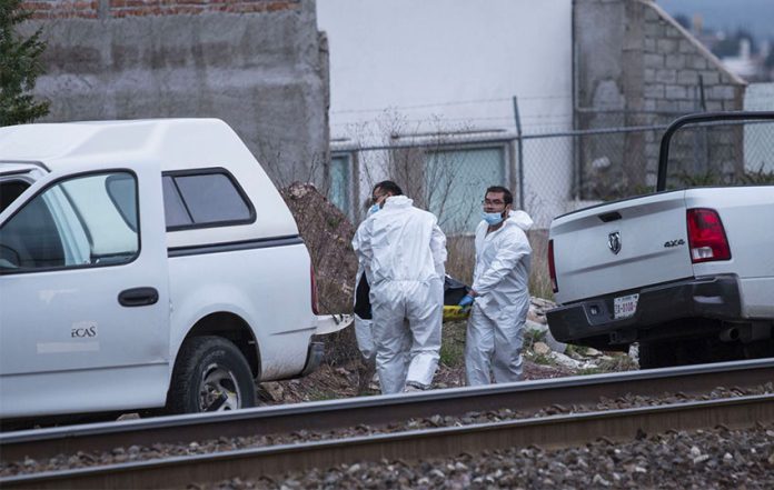Forensic personnel recover two bodies Thursday in Zacatecas.