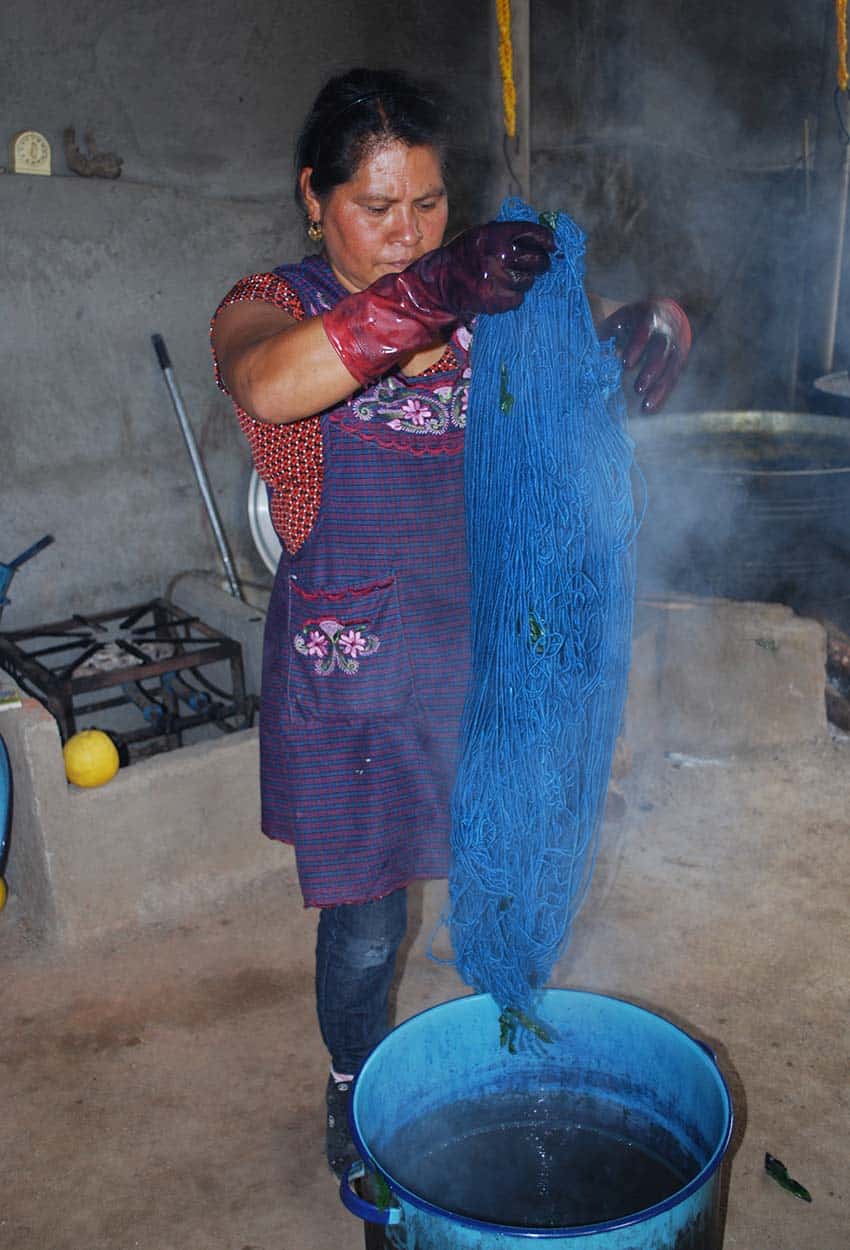 Juana Gutiérrez dyeing yarn with indigo in Teotitlan del Valle, Oaxaca