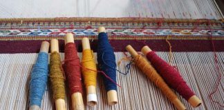 Skeins of yarn colored traditionally with natural dyes ready for weaving