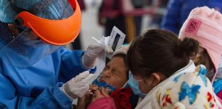 A child receives a Covid-19 test in Mexico City.