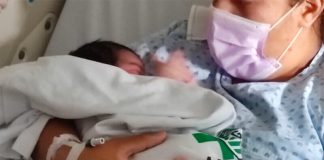 The baby was back in her mother's arms Thursday.