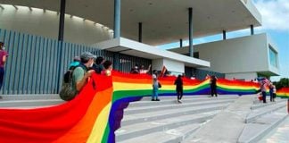 Supporters of the bill with a rainbow banner outside the legislature on Wednesday.