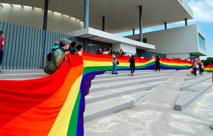 Supporters of the bill with a rainbow banner outside the legislature on Wednesday.