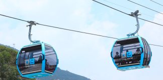 Cablebús cabins carry passengers over Mexico City.