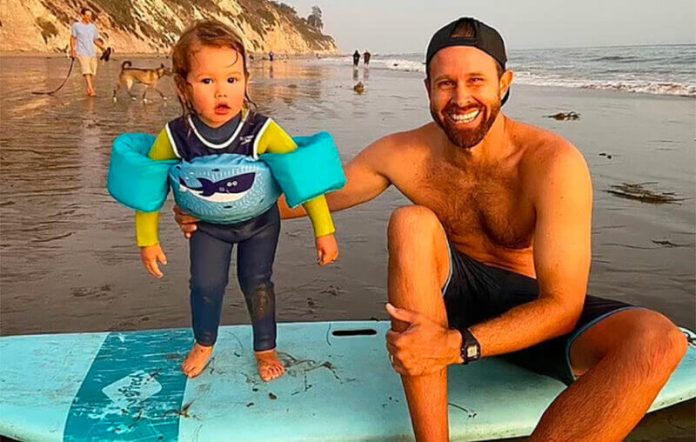 Surfing instructor Coleman with his son.