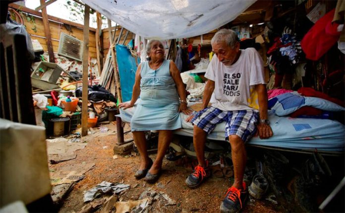 Hipólito Serna and Yolanda García in their roofless home in Poza Rica.