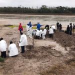 Forensics investigators search for bodies