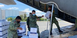 Government personnel load aid supplies onto a plane, in an image shared by the the Foreign Ministry