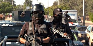 Two police officers in a security convoy